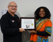 Food Safety 1st, Russell Scott presents Edenoku Ekhasomhi the 14,000th Food Safety 1st certificate.