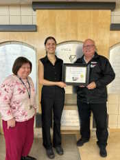 Russell Scott presents Amélia Gagnon the 18,000th certificate and endorsed by Helga Jantz with the Saskatoon YWCA.